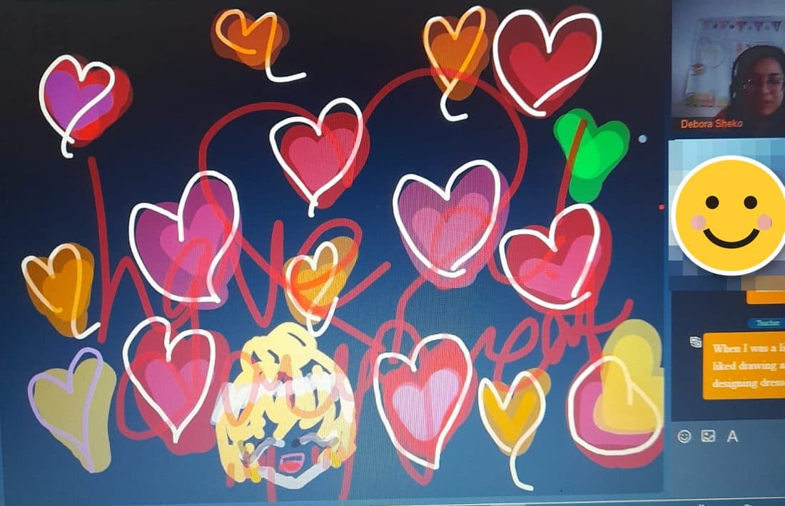 Hearts drawn together with a young student during an online English lesson